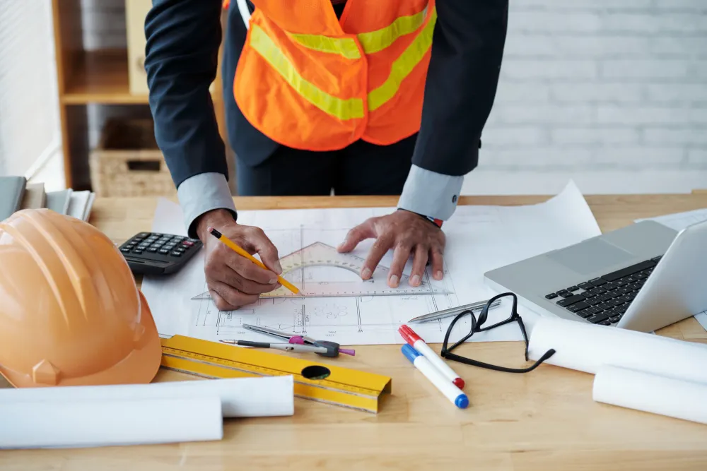 Construction professionals reviewing building plans